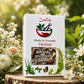 A boxed herbal soap product standing on a tree stump outdoors, surrounded by white flowers and green foliage. The front of the box reads 'Khalis by Everwide Herbal Bridal Whitening Soap' with a red and green mortar-and-pestle logo and botanical illustrations.